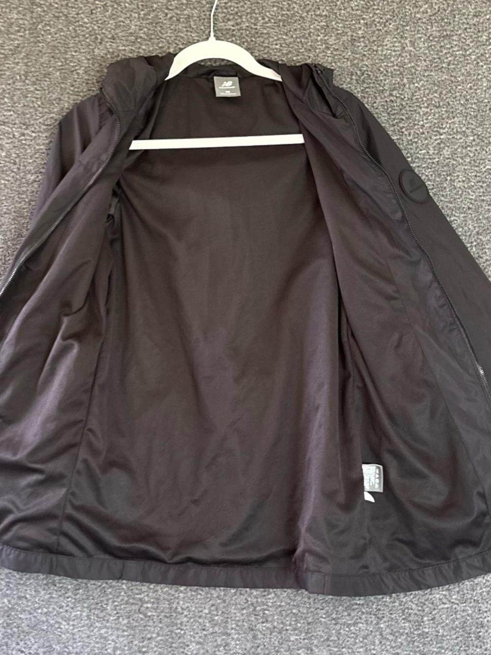 Like New "New Balance" black lightweight windbreaker jacket